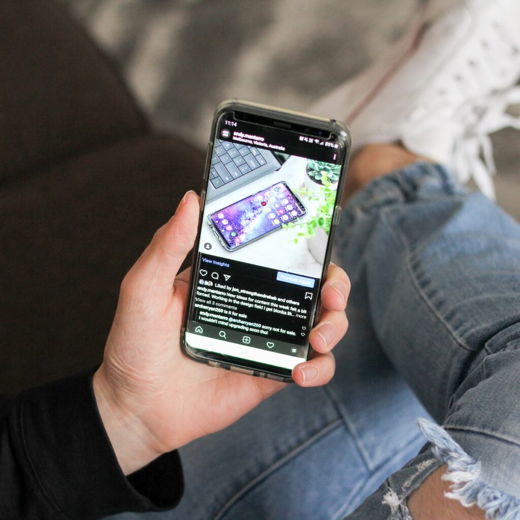 person holding instagram post