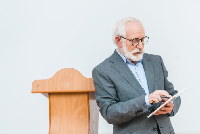 Pastor uses a tablet for sermon delivery with Logos.