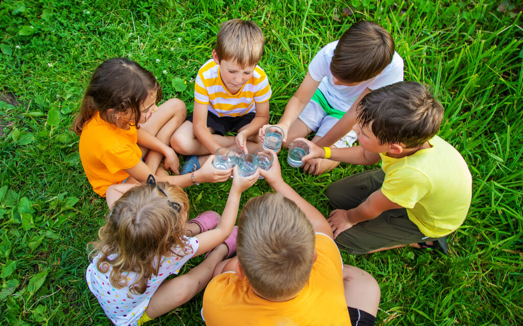 children drink water outside together selective f 2023 11 27 04 51 19 utc