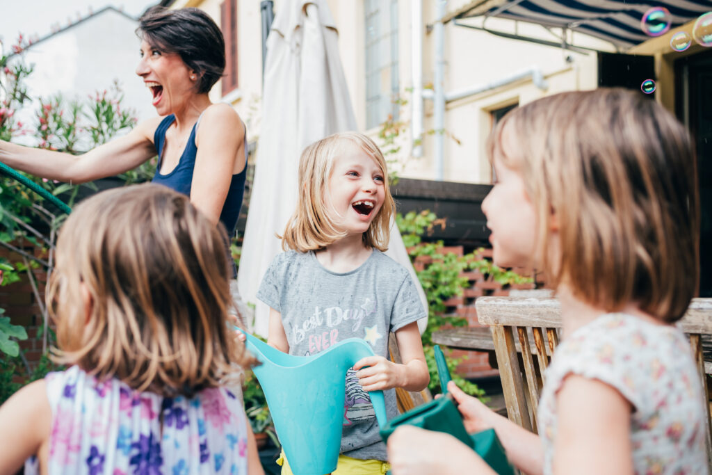 mother gardening at home with three daughter 2023 11 27 04 57 19 utc
