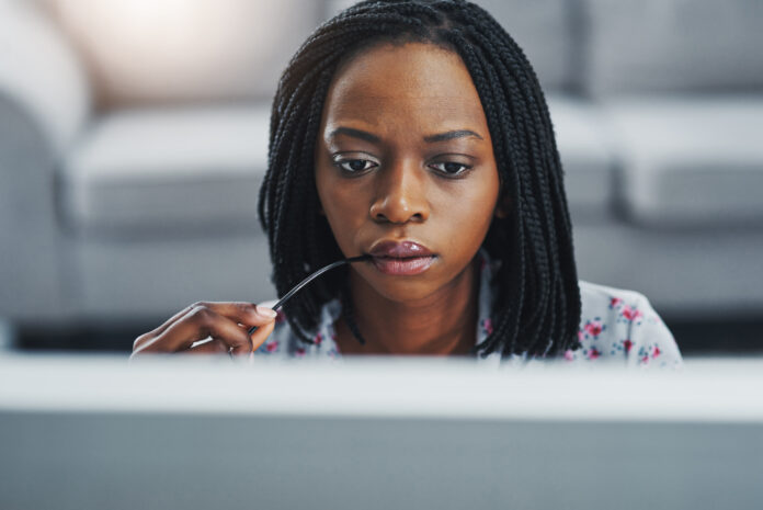 Woman on laptop highlighting church cybersecurity concerns