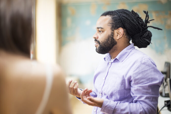 A pastor delivers a message that will later be repurposed for sermon podcasts.