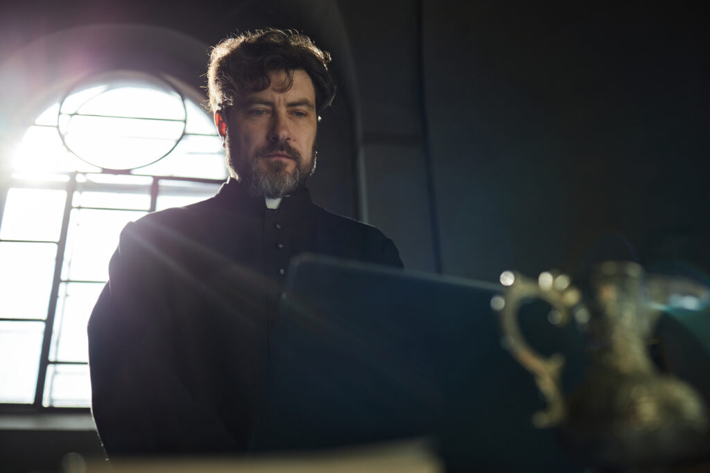 middle aged caucasian man praying inside church du 2026 03 25 06 34 11 utc